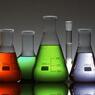 Chemical beakers of different sizes holding liquid of different colors.