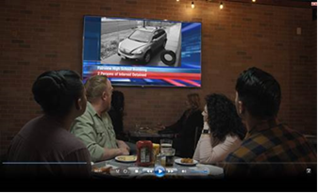 Screenshot of friends at a restaurant watching tv