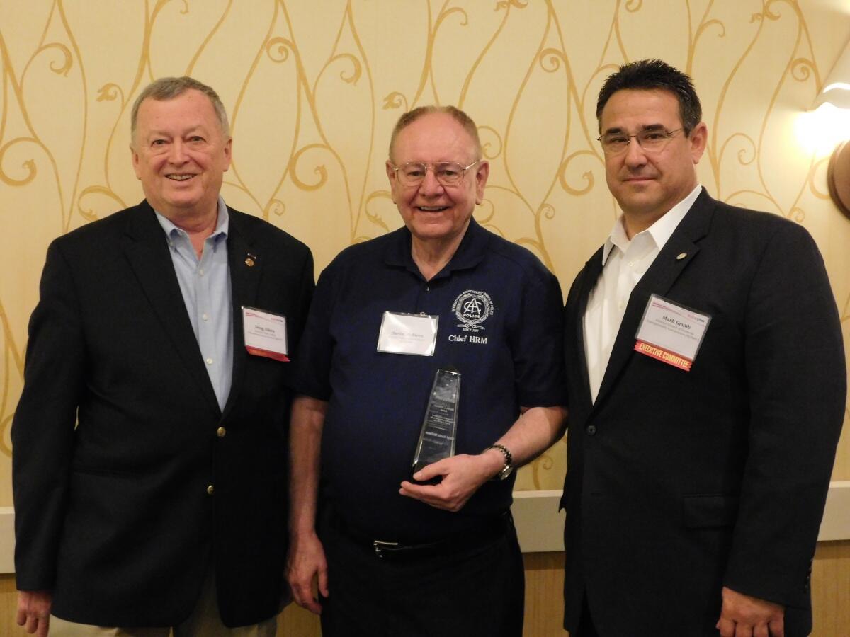 Harlin McEwen receives Marilyn J. Praisner Leadership Award pictured with SAFECOM Vice Chairs Doug Aiken and Mark Grubb 