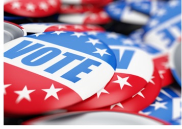 Image of red and blue buttons with the word "vote" on top of a blue-star background.