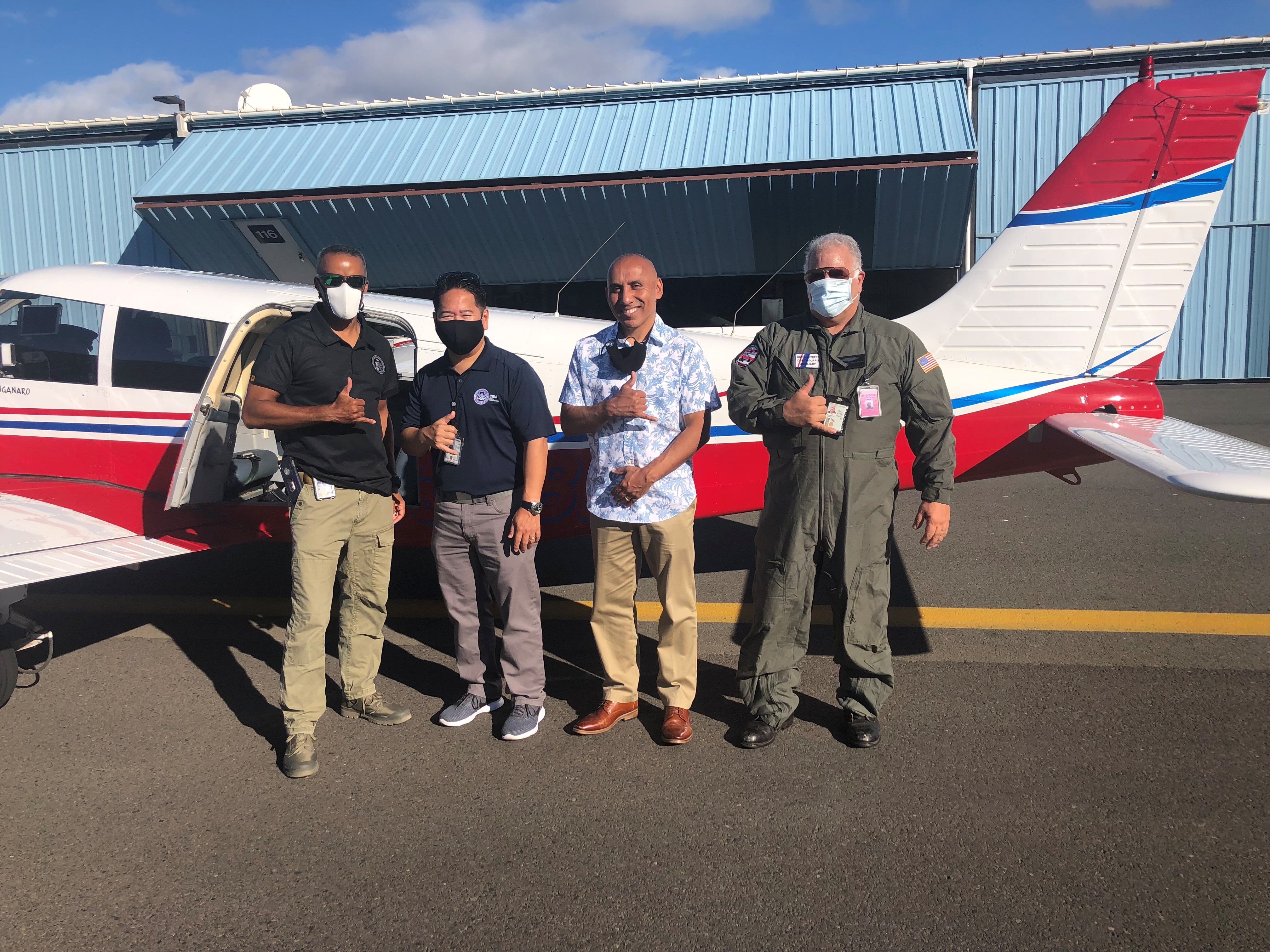 U.S. Coast Guard Auxiliary pilot John Manganaro (far right) provided (left to right) PSA Brian Keith, PSA Gen Tamura, RD David Rosado an area familiarization flight over the Hawaiian Islands. The flight highlighted the unique geography of the Hawaiian Islands and the criticality of the harbors and ports on Oahu, Molokai, Lanai and Maui.