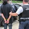 Immigration and Customs Enforcement apprehending a suspect