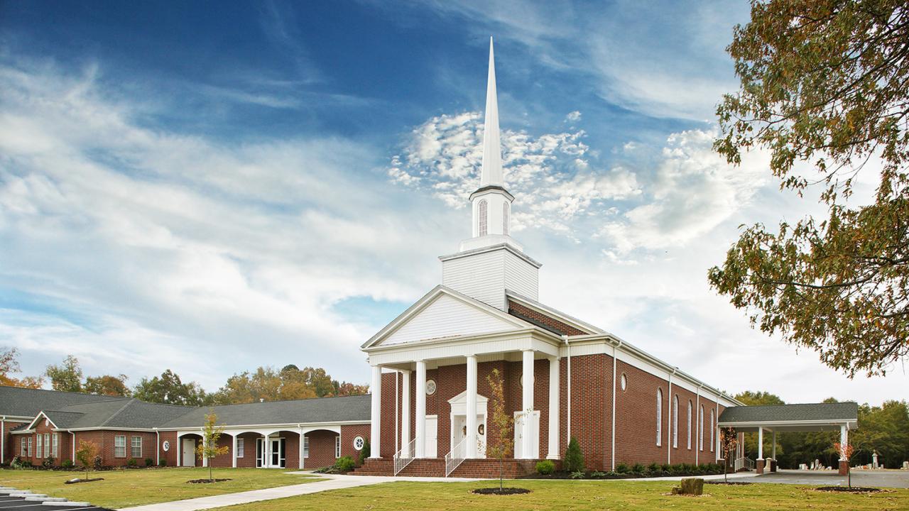 A traditional looking church against a blue sky