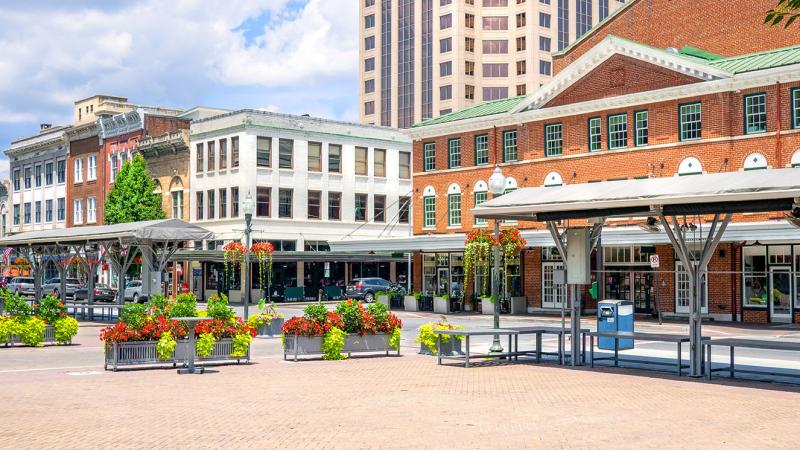 A photograph of a small town center with businesses