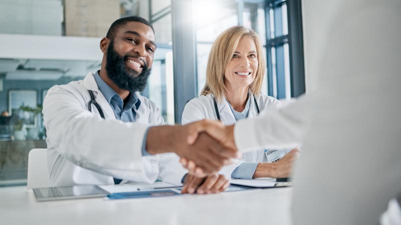 Healthcare handshake with partner