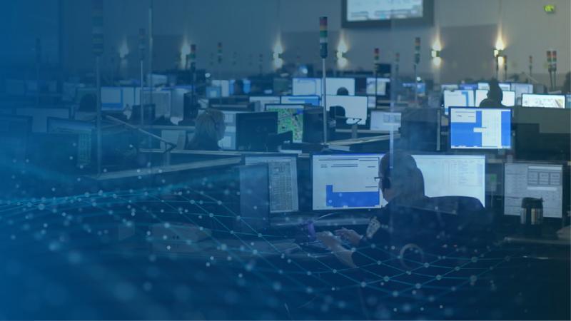 An emergency communications center with a digital wave overlay.