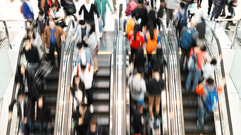 image of crowded escalators