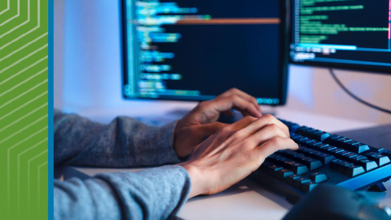 hands typing on a keyboard