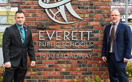 Members of Region 10 in front of Everett Public Schools Sign.
