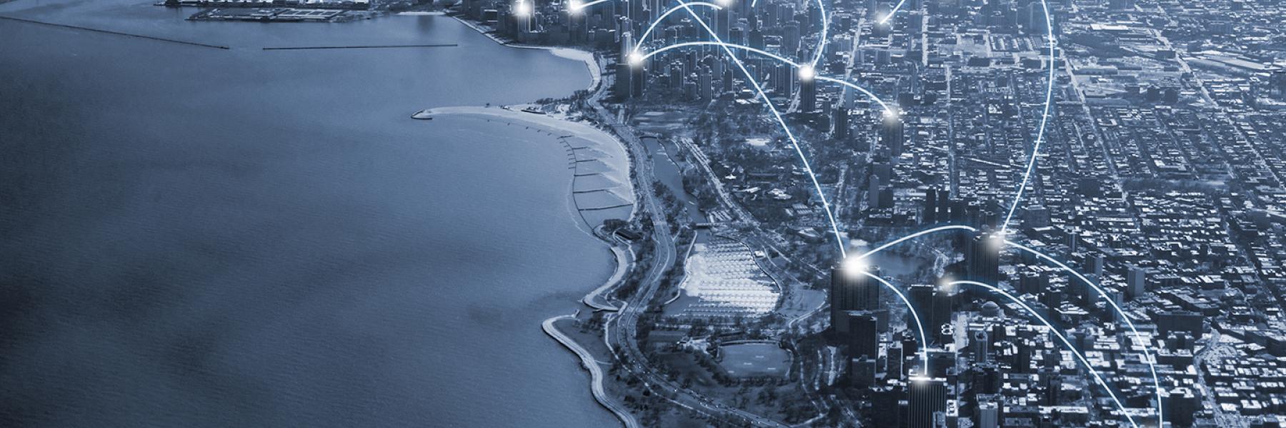 Waterfront edge of a dense city with connected nodes overtop buildings showing lines of communication.