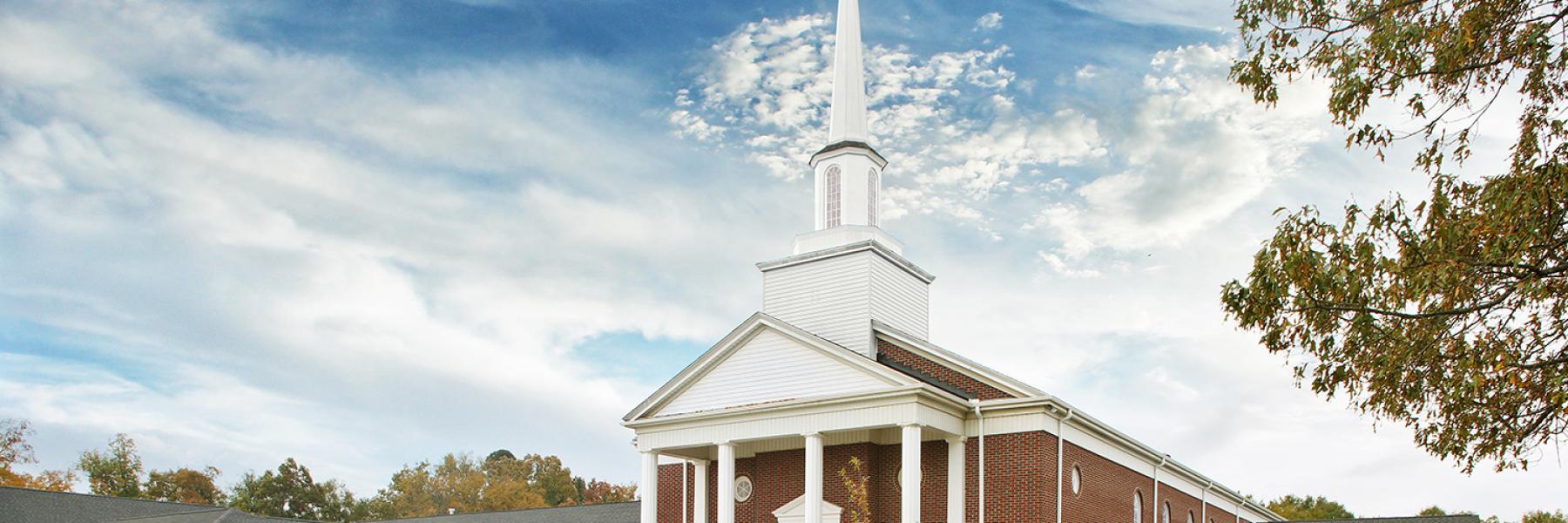 A traditional looking church against a blue sky