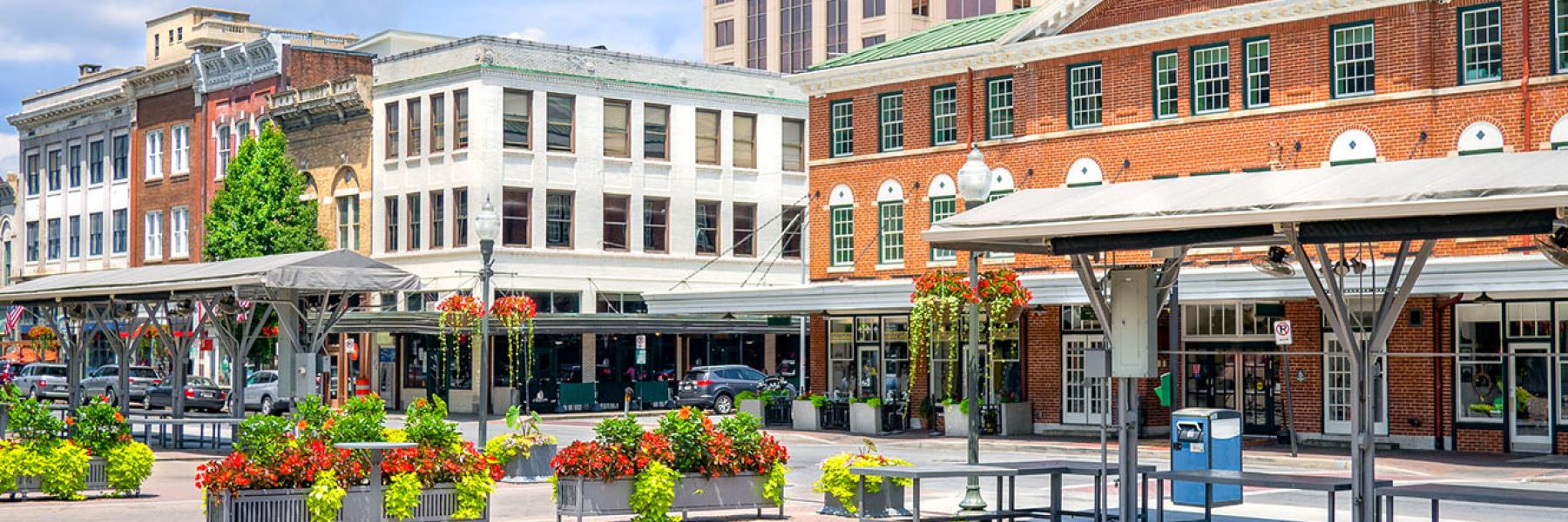 A photograph of a small town center with businesses