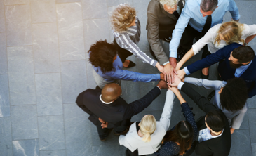 Group of professional people joining hands