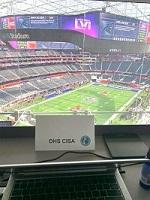 Image of Name Tag and computer overlooking SoFi Stadium.