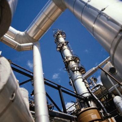 Pipes and smokestacks at a chemical facility.