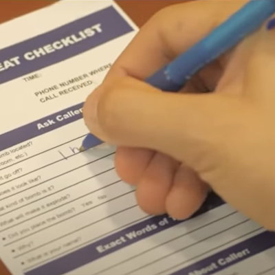 A photo showing a Bomb Threat Checklist